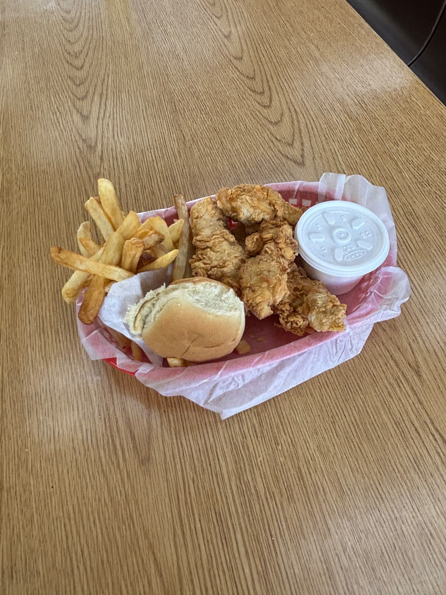 Fried chicken tender basket with fries, gravy, and a roll at Best Fried Chicken